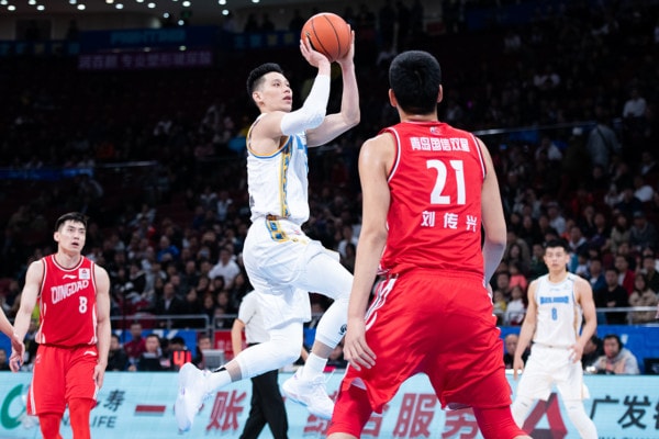 Former NBA player Jeremy Lin shoots during a CBA game between Beijing Shougang Ducks and Qingdao Eagles.
